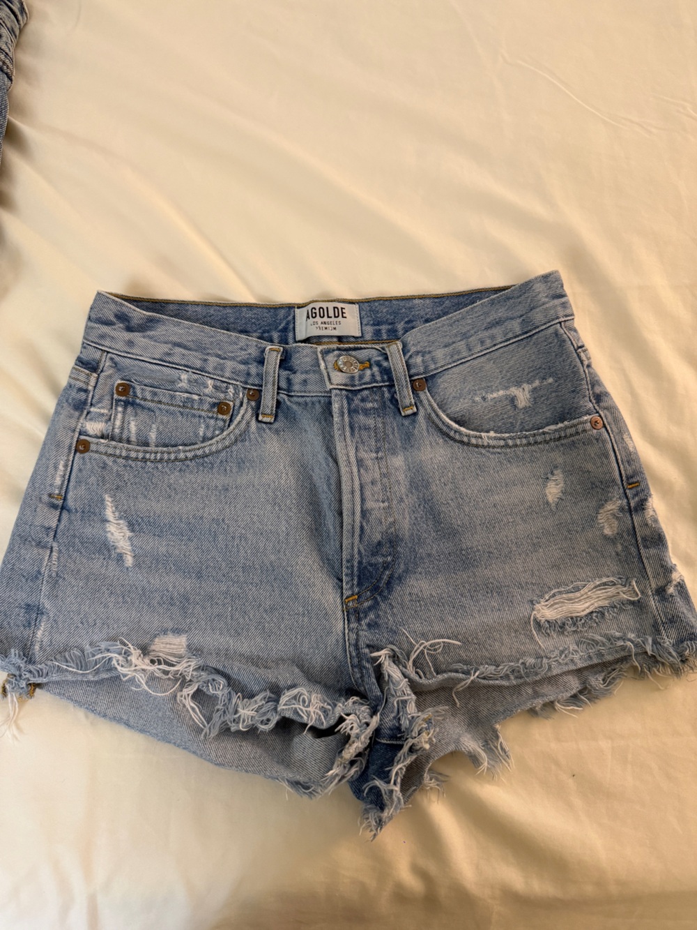 Agolde Light Blue Distressed Denim Cutoff Shorts